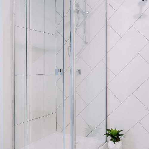 Shower in semi frameless shower screen