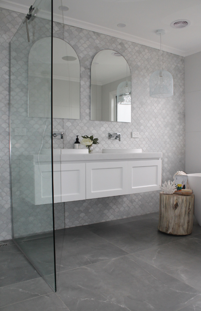 Modern tiled bathroom with white ceramic sink