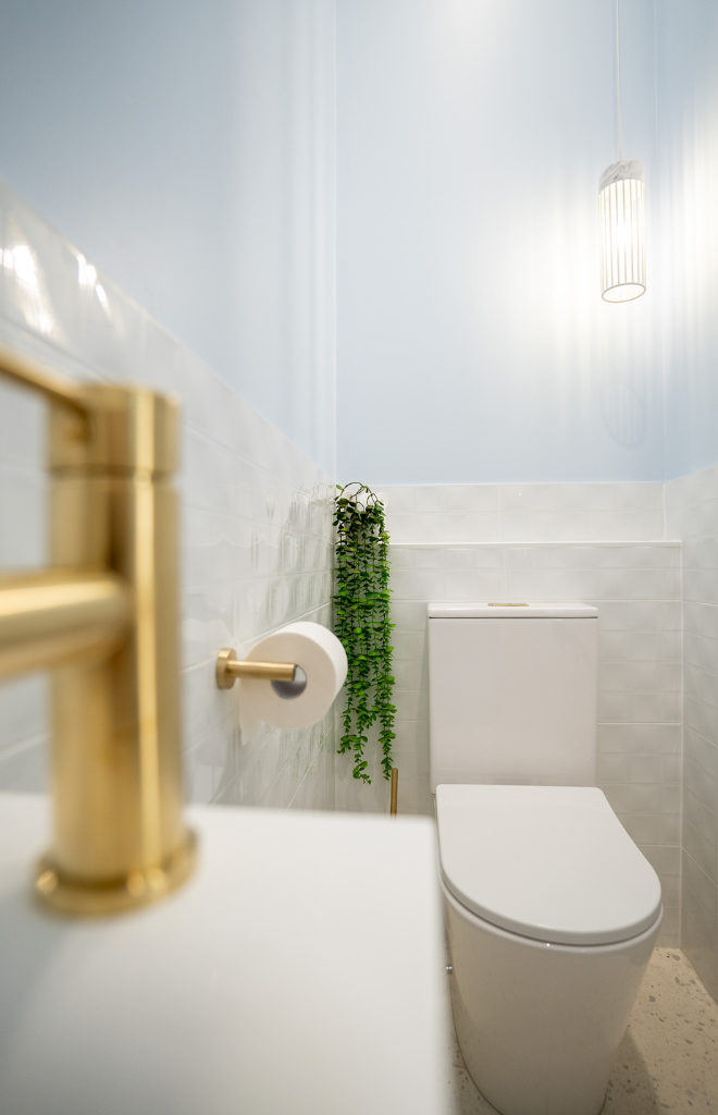 golden tap in modern bathroom
